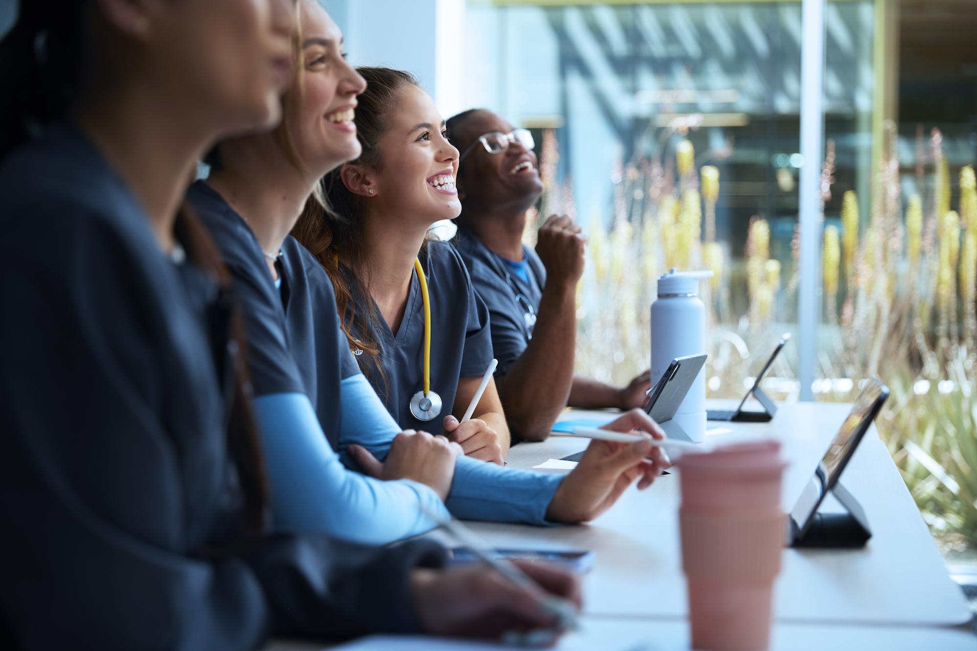 Alliant Nursing Students Smiling and Listening in Class